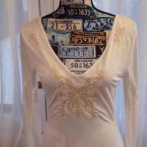 Long gathered sleeve tee.